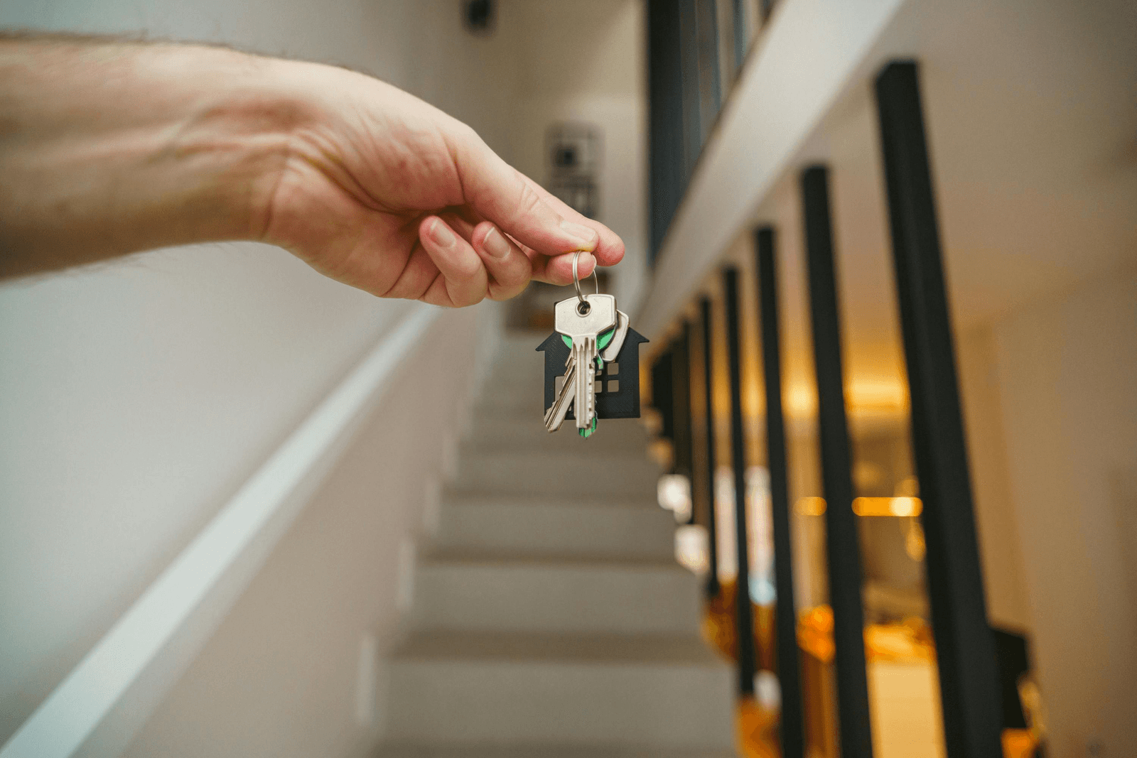 A Dubai property owner handing over the keys to their apartment